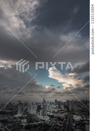 Aerial view of skyscrapers and dramatic sky before sunset. Aerial view of skyscrapers and dramatic sky before sunset. 118313804