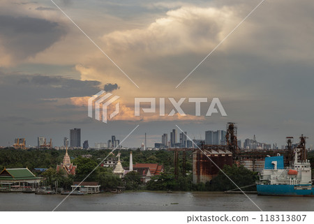 View of green forest area of Bang kachao overlooking Thai temples, Petroleum refinery and cargo ship alongside the Chao Phraya River. View of green forest area of Bang kachao overlooking Thai temples, Petroleum refinery and cargo ship alongside the Chao Phraya River. 118313807