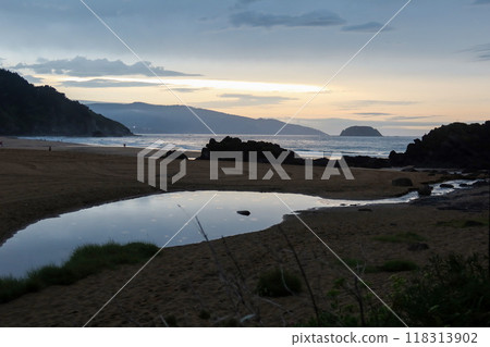 Sunset Breaking Through Clouds at Laga Beach, Basque Country Sunset Breaking Through Clouds at Laga Beach, Basque Country 118313902