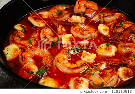 Greek saganaki, in an iron pan, saganaki with shrimp, shrimp in tomato sauce, with pepper and feta cheese, homemade, no people, 118313918