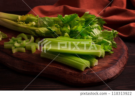 fresh bunch of celery, top view, no people, on a dark background, 118313922