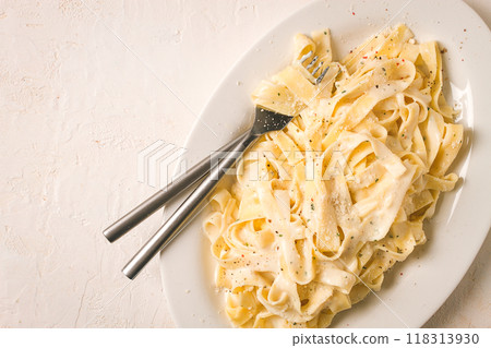 Fettuccine, tagliatelle, in creamy garlic sauce, Italian traditional cuisine, pasta carbonaro, Fettuccine, tagliatelle, in creamy garlic sauce, Italian traditional cuisine, pasta carbonaro, 118313930