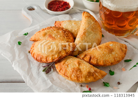 Fried chebureks, close-up, on a light background, no people, 118313945