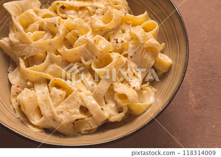 Fettuccine, tagliatelle, in creamy garlic sauce, Italian traditional cuisine, pasta carbonaro, Fettuccine, tagliatelle, in creamy garlic sauce, Italian traditional cuisine, pasta carbonaro, 118314009