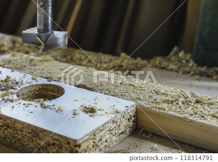 Drilling holes in the particle board Drilling holes in the particle board 118314791