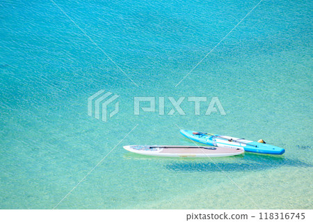 Stand up paddle board on the beach Stand up paddle board on the beach 118316745