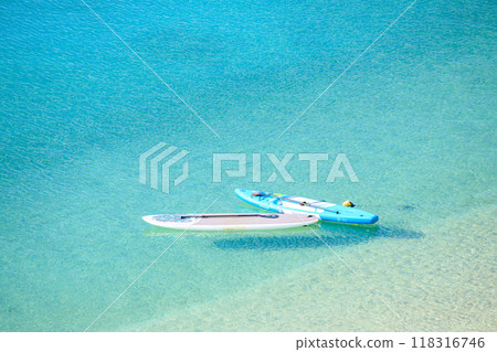 Stand up paddle board on the beach 118316746