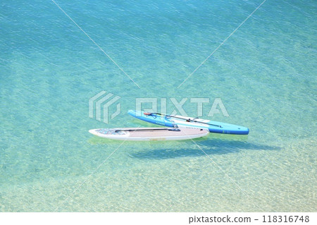 Stand up paddle board on the beach 118316748