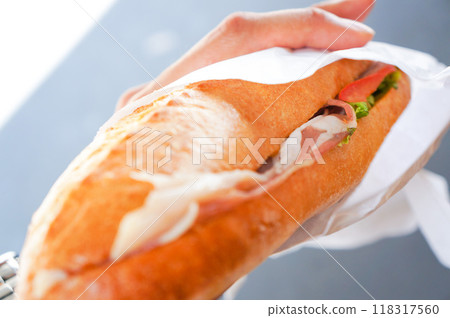 Delicious bread with prosciutto sandwiched in it 118317560