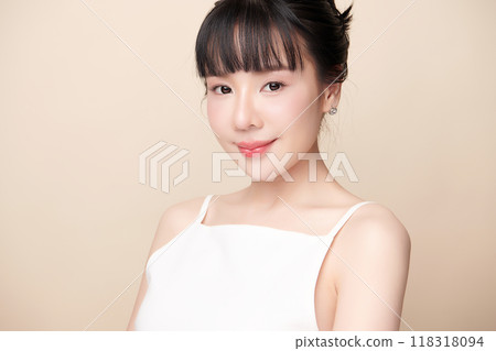 Beautiful young asian woman with clean fresh skin on beige background, Face care, Facial treatment, Cosmetology, beauty and spa, Asian women portrait. Beautiful young asian woman with clean fresh skin on beige background, Face care, Facial treatment, Cosmetology, beauty and spa, Asian women portrait. 118318094
