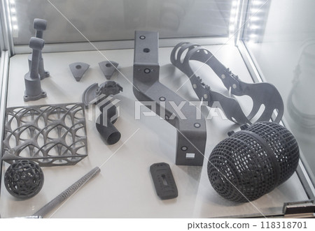 Various objects printed on a 3D printer from molten plastic powder. Different models printed on 3D printer from melted grey polyamide powder. New additive 3D printing Multi Jet Fusion MJF technology 118318701