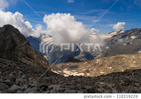Majestic Mountain Range with Rocky Terrain and Cloud Cover 118319229