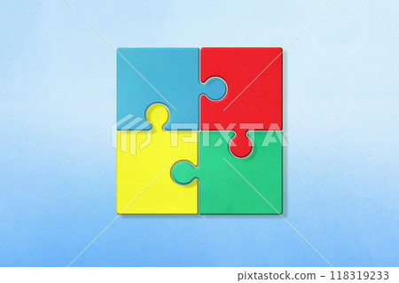 帶有陰影的拼圖，在藍色背景上結合了四種顏色：藍色、紅色、黃色和綠色 118319233