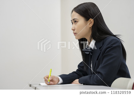 Profile of a high school girl studying. Photo courtesy of Ariake College of Education and Arts. 118320559