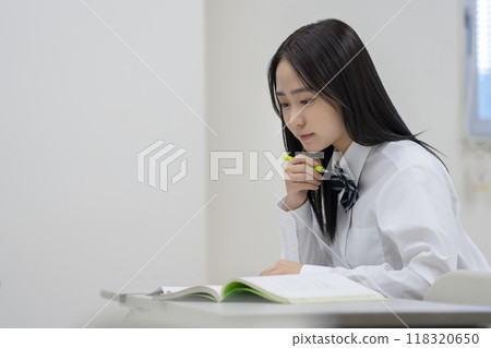 Profile of a high school girl studying. Photo courtesy of Ariake College of Education and Arts. Profile of a high school girl studying. Photo courtesy of Ariake College of Education and Arts. 118320650