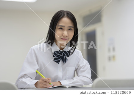 High school girls studying, looking at the camera, photo courtesy of Ariake College of Education and Arts High school girls studying, looking at the camera, photo courtesy of Ariake College of Education and Arts 118320669