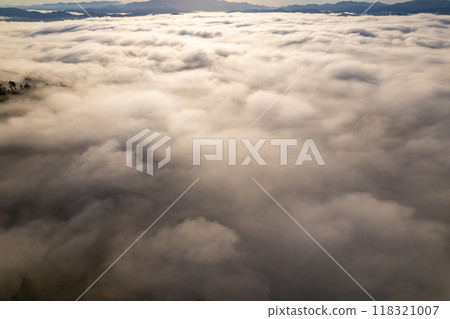 Amazing Sunrise or sunset over mountains hills covered with mist, Aerial view landscape drone shot beautiful colorful nature background 118321007