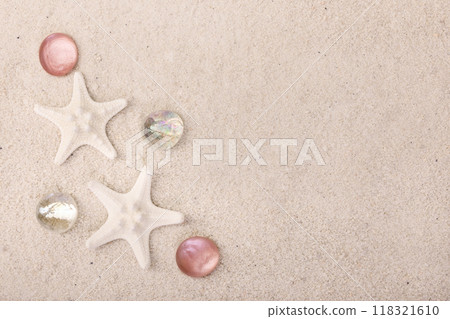 Border with star fish and red pebbles on white sand. Border with star fish and red pebbles on white sand. 118321610