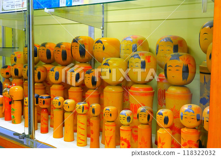Naruko Kokeshi dolls on a display shelf 118322032