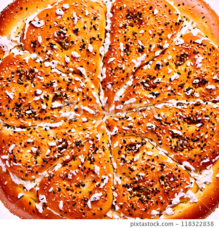 Bagel mandala a mandala of toasted bagels with cream cheese spreading and seeds falling 118322838
