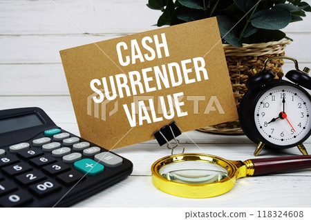 Cash Surrender Value text on paper card with alarm clock, calculator and magnifying glass on wooden background Cash Surrender Value text on paper card with alarm clock, calculator and magnifying glass on wooden background 118324608
