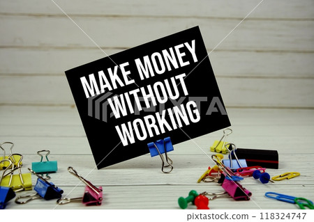 Make Money Without Working text on paper card with stationary on wooden background 118324747