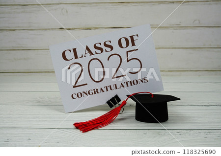 Class of 2025 and Congratulations text on paper card with Class of 2025 and Congratulations text on paper card with 118325690