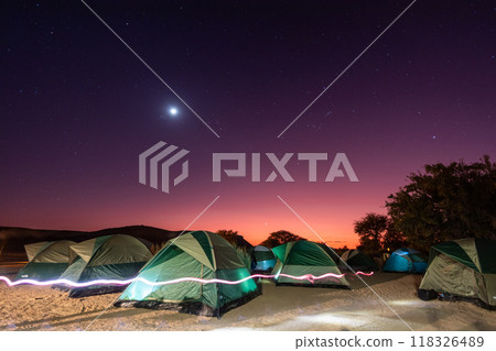 Full moon over a campsite 118326489