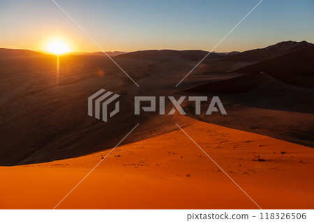 Climbing Dune 45 at sunrise 118326506