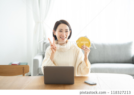 A woman holding a wallet Peace 118327213