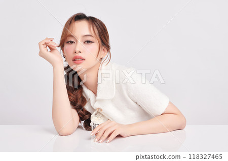 Beautiful young asian woman with clean fresh skin on white background, Face care, Facial treatment, Cosmetology, beauty and spa, Asian women portrait. Beautiful young asian woman with clean fresh skin on white background, Face care, Facial treatment, Cosmetology, beauty and spa, Asian women portrait. 118327465