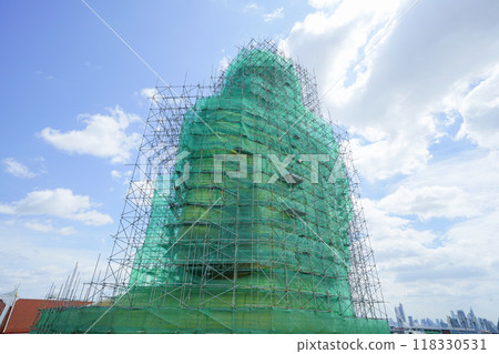 A giant Buddha statue at Wat Paknam Phasicharoen temple in Bangkok undergoing repairs A giant Buddha statue at Wat Paknam Phasicharoen temple in Bangkok undergoing repairs 118330531