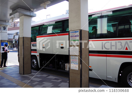 A highway bus about to depart, with its luggage compartment doors open at the JR Matsue Station North Exit bus terminal to store passengers' luggage. A highway bus about to depart, with its luggage compartment doors open at the JR Matsue Station North Exit bus terminal to store passengers' luggage. 118330688
