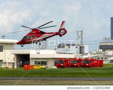 Disaster prevention helicopter and airport chemical fire engine taking off from Yao Airport 118331069