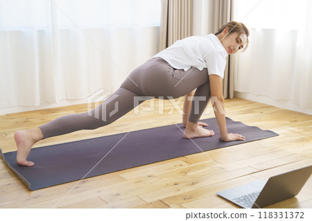 A young woman delivering an online yoga salon 118331372