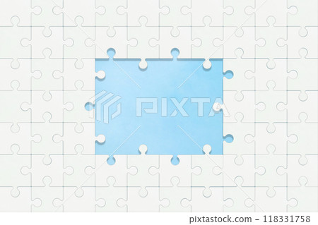 A plain white jigsaw puzzle window with a pale sky peeking through A plain white jigsaw puzzle window with a pale sky peeking through 118331758