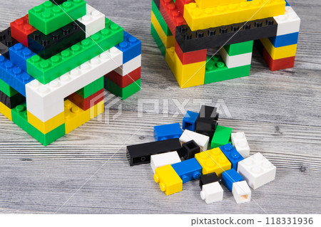 Small houses made of toy blocks. Development of kids coordination, creativity 118331936