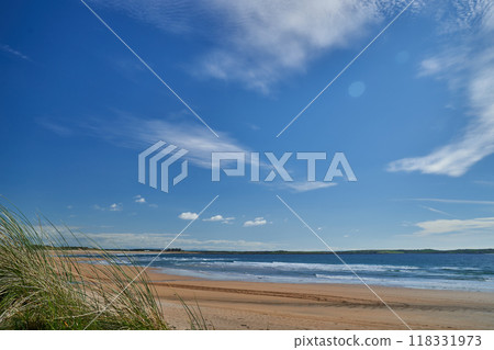 ocean bay ireland sand beach blue sky 118331973