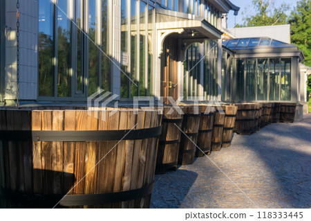 wooden plant pots next to the wall of an orangery wooden plant pots next to the wall of an orangery 118333445