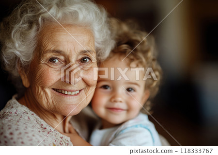 Loving grandmother holding her young grandchild 118333767