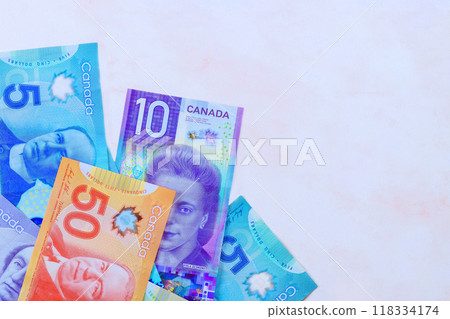 There is wide variety of Canadian money in Canada dollar in various denominations issued by Canadian Bank There is wide variety of Canadian money in Canada dollar in various denominations issued by Canadian Bank 118334174