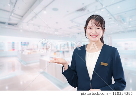 Young woman working in a cosmetics store 118334395