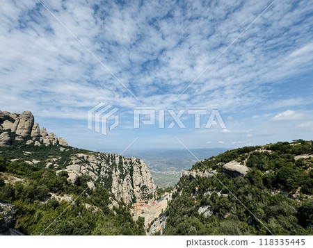 Sheer cliffs and mountains in the distance - From Montserrat, Spain Sheer cliffs and mountains in the distance - From Montserrat, Spain 118335445
