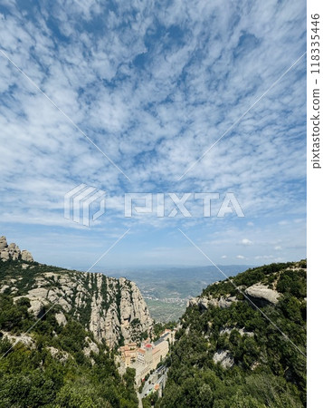 Sheer cliffs and the horizon and towns visible in the distance - from Montserrat, Spain Sheer cliffs and the horizon and towns visible in the distance - from Montserrat, Spain 118335446