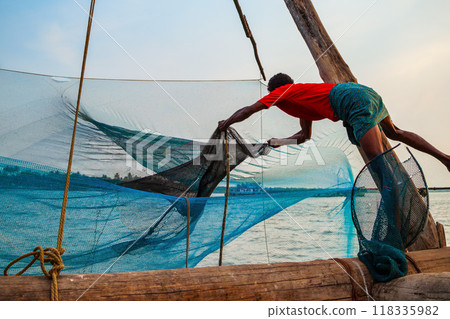 Fisherman and chinese fishing nets 118335982