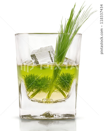 Polish Zubrowka in shot glass accompanied by blade of grass and few ice cubes 118337434