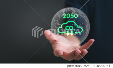 Hand holding globe with carbon reduction symbols and 2050 target, promoting sustainability. Ideal for environmental policies, green energy initiatives, climate change solutions. Hand holding globe with carbon reduction symbols and 2050 target, promoting sustainability. Ideal for environmental policies, green energy initiatives, climate change solutions. 118338961