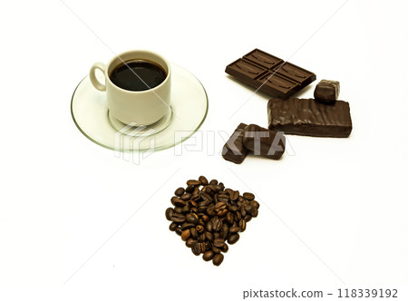 Grains of coffee, a cup of coffee, chocolate and chocolate sweets Grains of coffee, a cup of coffee, chocolate and chocolate sweets 118339192