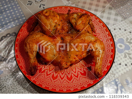 Fried chicken on a platter. Oven baked chicken, ready to eat. 118339343