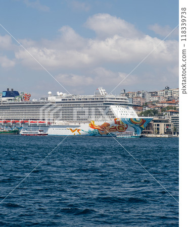 Anchored cruise ship off the coast of Istanbul, with the city's historic skyline visible. Perfect for travel, tourism, and maritime content Anchored cruise ship off the coast of Istanbul, with the city's historic skyline visible. Perfect for travel, tourism, and maritime content 118339738